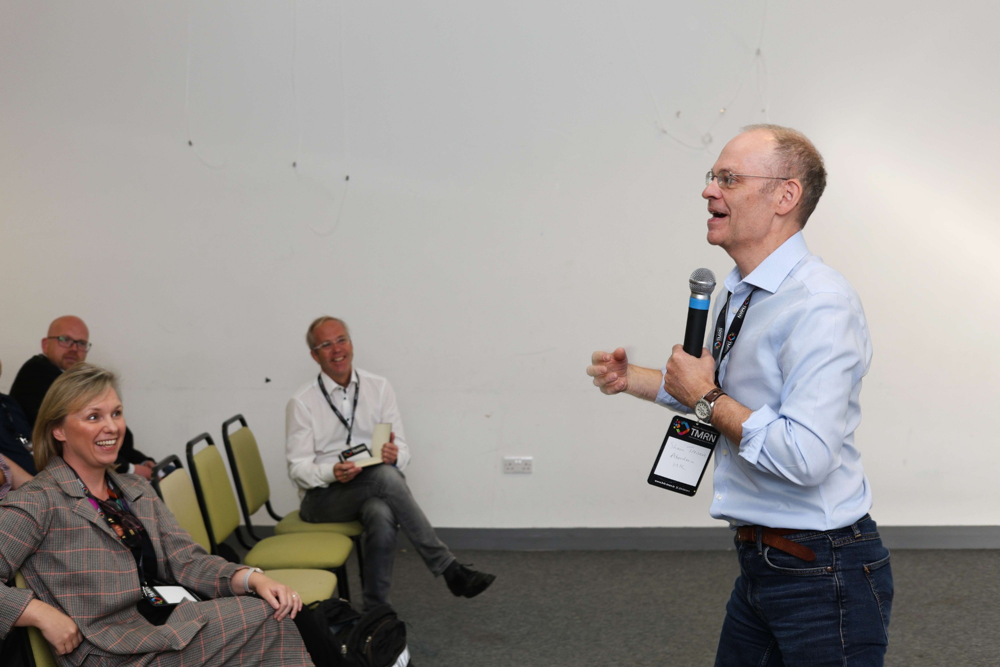 Prof Shaun Treweek speaking with participants during a session